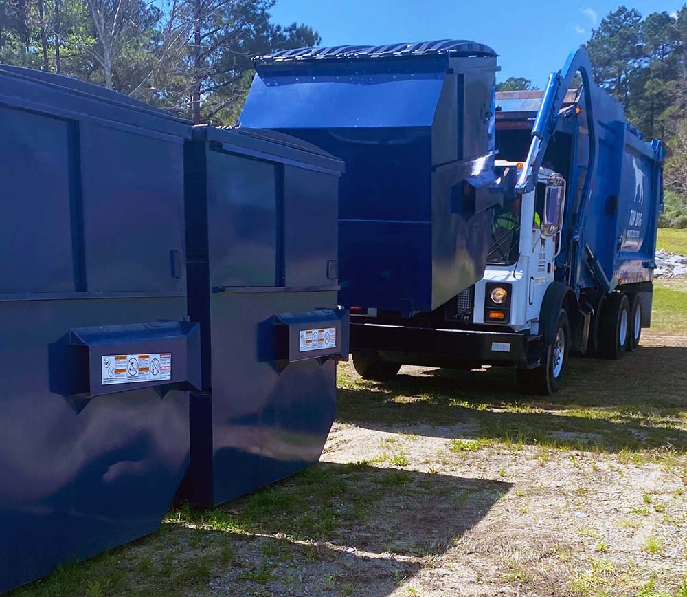 Top dog Waste Solutions trucks and large bins